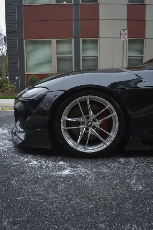 Supra wheel and red brake caliper, washed and dressed
