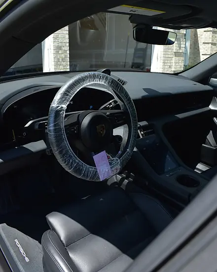 Porsche interior after a detail, steering wheel wrapped to keep it clean