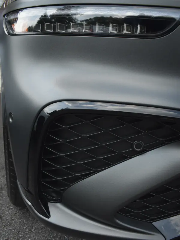 Matte grey Genesis front bumper and grille detailed