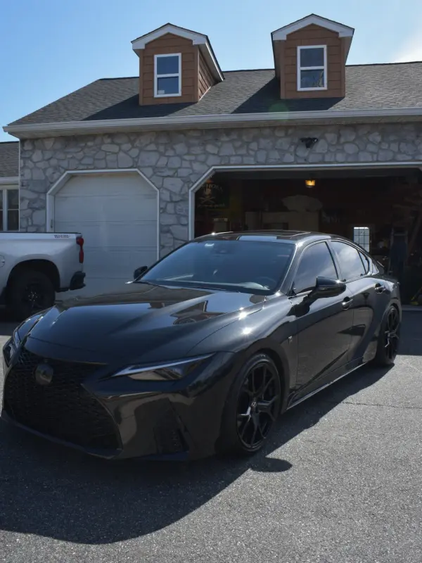 Black Lexus IS gleaming on a Maryland driveway